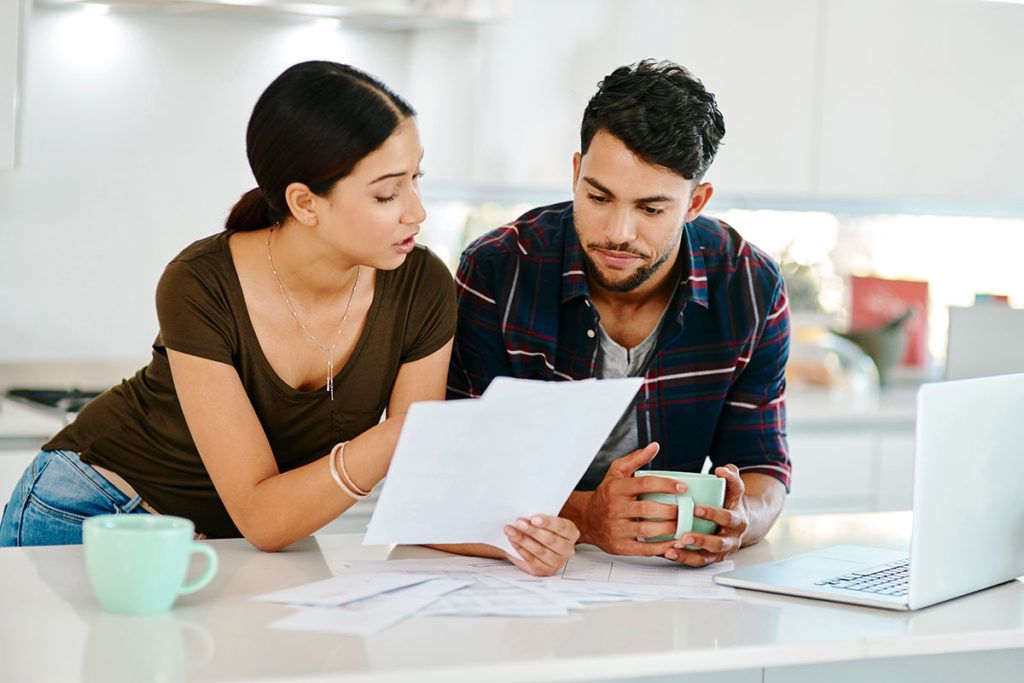 couple-reading-papers-alpine-medical-group-new-patients